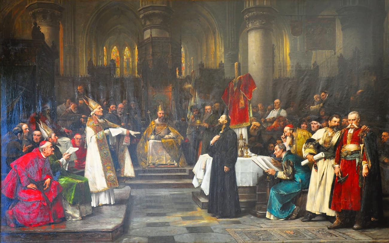 Pintura histórica do século XIX: Hus, de pé, no meio de uma assembleia de prelados e nobres, fala diante do concílio