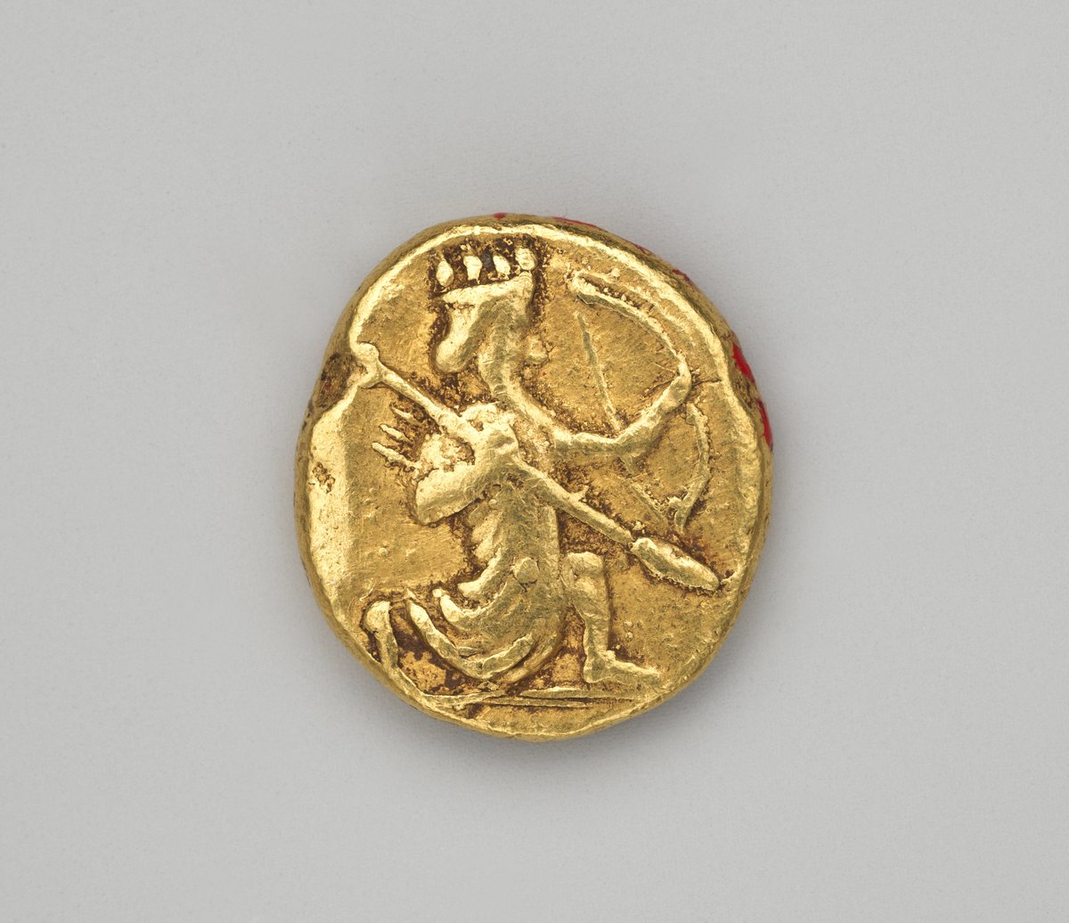 Moeda de ouro persa, o dárico, com o rei arqueiro ajoelhado